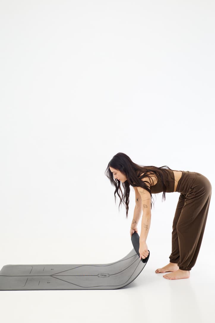 Lauren rolling out her yoga mat